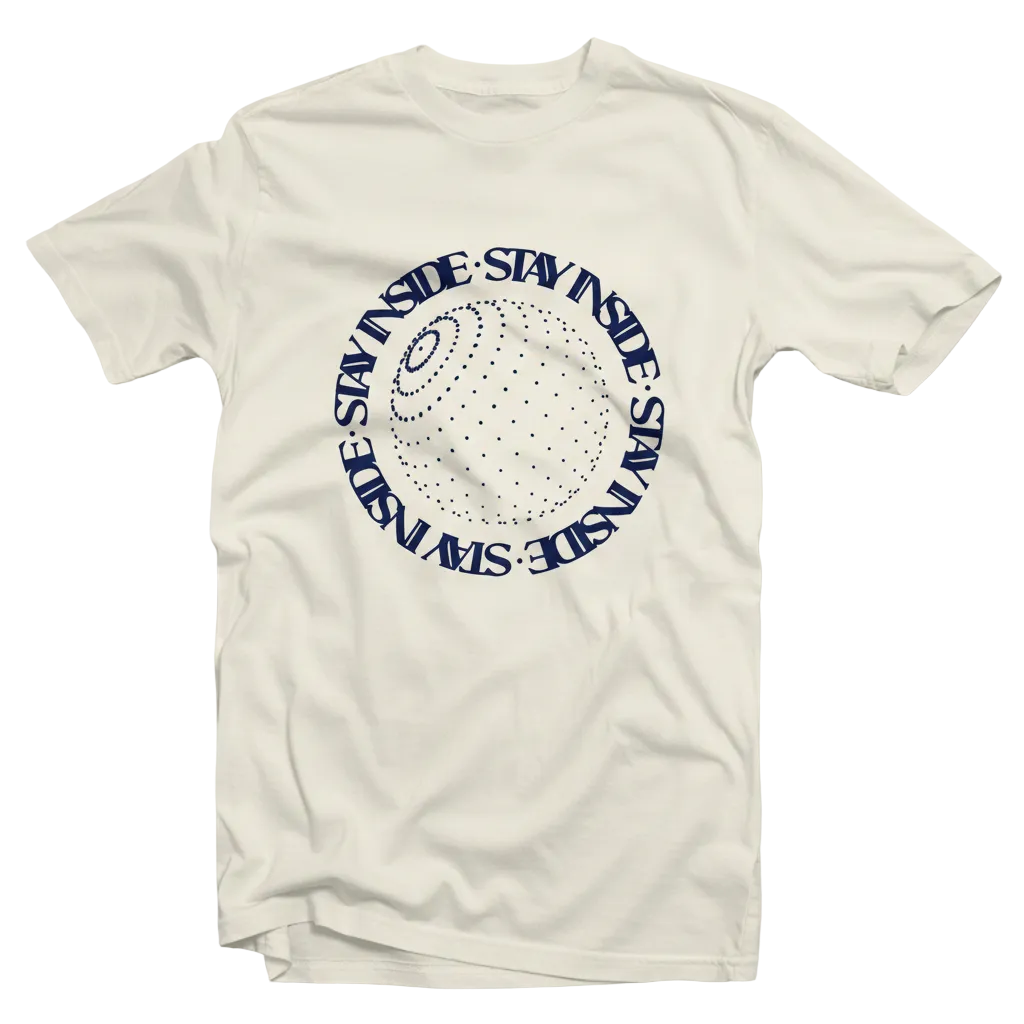 An off-white crewneck t-shirt featuring a navy blue circular graphic on the chest with the text 'STAY INSIDE' repeated around a dotted globe design.