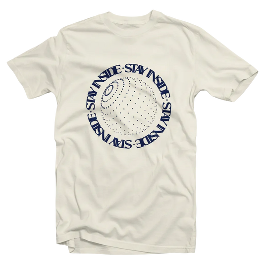 An off-white crewneck t-shirt featuring a navy blue circular graphic on the chest with the text 'STAY INSIDE' repeated around a dotted globe design.